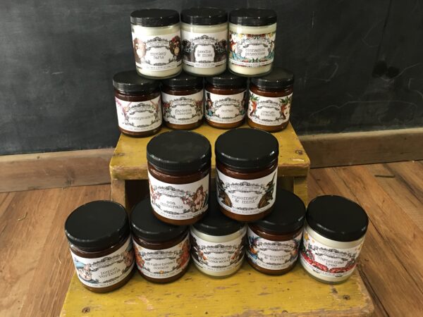 stack of jars of sauces on a table